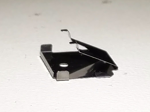 File:Alps SKCM -- click-modified tactile leaf from cream damped switch.jpg