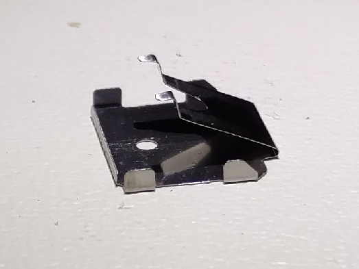 File:Alps SKCM -- tactile leaf from cream damped switch.jpg