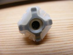 Bottom view of rubber dome showing carbon contact pad