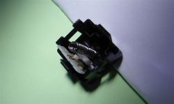 Bottom part of the case, with spring, lever and contacts