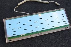 Cardboard shielding behind the PCB connected with a wire to ground