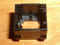 Upper shell: note the two grooves at the rear, which hold the contact plates