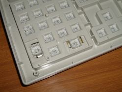 Sliders close-up, with one slider depressed (first column, third row in the picture)