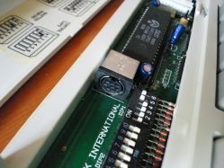 Internal cable connector, under the DIP switch cover
