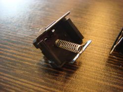 Base with return spring