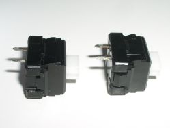 Side views showing snapped and intact retention clips