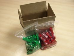 Green and red sets in their packaging