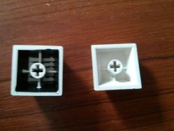 Comparison of the backs of the standard (left) vs. Polish-language (right) keycaps.
