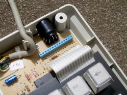 The switch PCB connects to the controller PCB via a ribbon cable