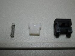 Return spring and slider