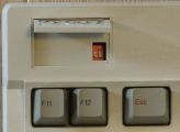 DIP switches underneath the logo plate