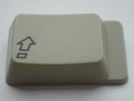 Symbolic caps lock from a European AppleDesign Keyboard for Macintosh