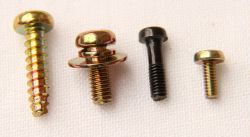 Screws from a Topre keyboard. Left to right: case screw, grounding screw, PCB screw (type 1), PCB screw (type 2).