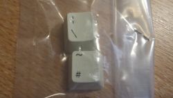 Tops of two spare keycaps