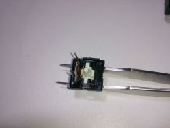 Top casing with contact mechanism and slider<ref name="haata-gallery"/>