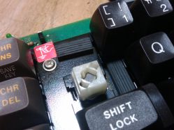 Cross reed slider. Note the magnet in the center of the slider.