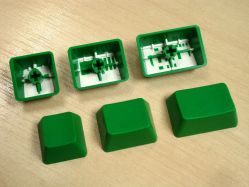 The three sizes of blank keycap supplied; they are still double-shot moulded despite having no legends