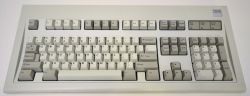 IBM PC AT Keyboard, Part Number 1390131. It can be distinguished from the more common 1391401 by the square metal logo at its top right.