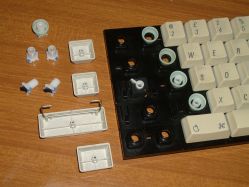 Switches and keycaps; the latching switch under Caps Lock can be seen