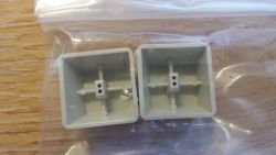 Bottom of two spare keycaps