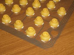 Pressure domes from the AppleDesign Keyboard, glued down onto the top membrane sheet