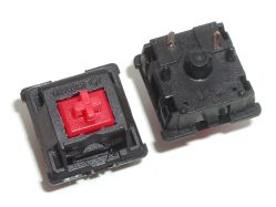 Red PCB mount with RGB LED slot; the bottom branding can be seen