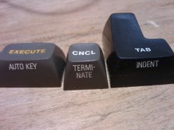 Cross reed double-shot keycaps, with front filled engravings.