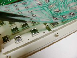Undersides revealing the "clicky" switch over membrane.