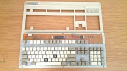 Keyboard partly disassembled revealing some of the internal components