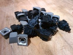 A bunch of Honeywell Hall Effect switches and keycaps, Model 4A3A.