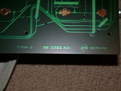 Markings on the PCB including Mitsumi branding