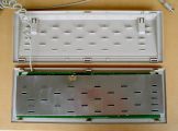 Bottom case part with standoffs, shielding on the PCB with cutouts for the standoffs