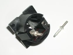 The legs connect to the contact assembly via the bent edges of the holes