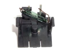 Reed capsule connected to the terminals via leads