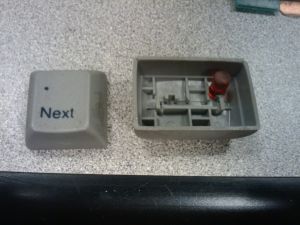 Dirty grey dye sublimation keycap, and underside of cap locks key.