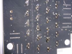 PCB mounting, notice the two small black pegs that secure each switch