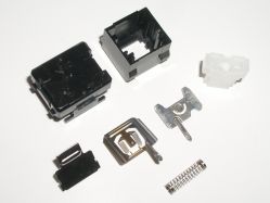 Disassembled switch, showing bottom and rear views of each component