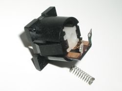 The contact assembly slides out easily; note that the empty recess above the slider holds the latch track block in the Futaba linear lock