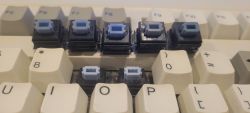 Comparison with other various Blue Alps switches, highlighting differences in dye consistencies vs. the paler "Pale/Sky" blue stem.
