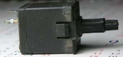 Side view, showing new plate retention clips