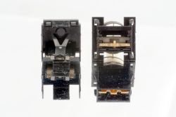 Internals showing plate in place in the lower case and other parts in the upper case