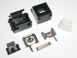 Disassembled switch, showing top and front views of each component