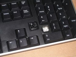 Keycap removed from a rubber dome keyboard