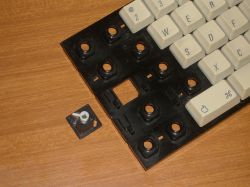 The switch slots into a hole in the slider mounting plate
