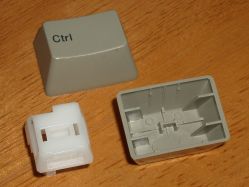 Peg-and-slot slider and keycap from a Fujitsu FKB4700