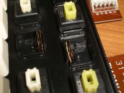 Yellow switches have taller slider stops, to reduce travel by around 1 mm