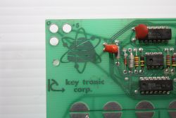 Beehive and Key Tronic logos on PCB