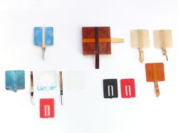 Production and prototype contact assemblies, and actuators; the brown material will be Kapton