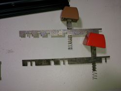 Encoder bars, springs, sliders and keycaps; reverse side
