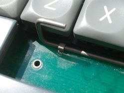 The space bar stabiliser wire is retained using soldered-in metal loops